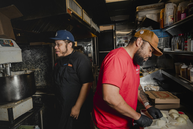 Down North Pizza staff Kaseem Ali, left, with executive chef Michael Carter, in the kitchen